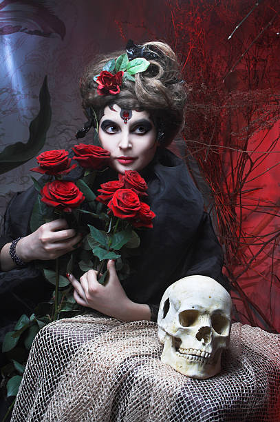 istock Woman with roses and skull 489483807