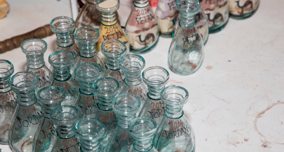 traditional local souvenirs in Jordan- bottles with sand and shapes of desert and camels