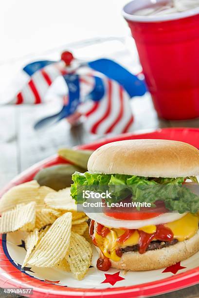 Cheeseburger Loaded With Toppings In A Patriotic Theme Stock Photo - Download Image Now