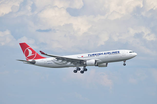Turkish Airlines Airbus A330 landing Istanbul, Turkey - May 2, 2014: Turkish Airlines Airbus A330 landing at Istanbul Ataturk Airport.  This aircraft, TC-JNA, was delivered in 2005 and it is the first A330 in the Turkish Airlines fleet. landing touching down stock pictures, royalty-free photos & images