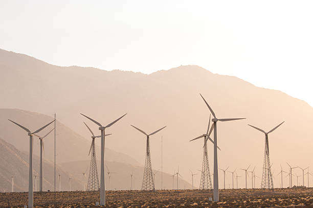 istock Windmills and Mountains at Sunset in California 489486090