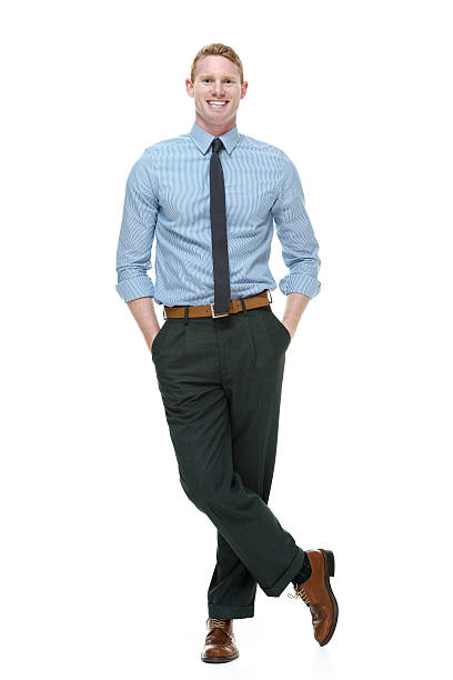 istock Smiling businessman standing with hands in pockets 489486963