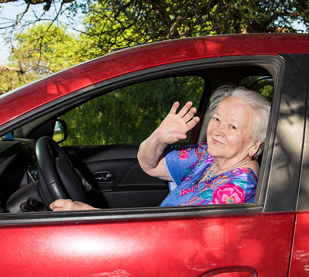 istock Old woman sitting inside the car 489487046