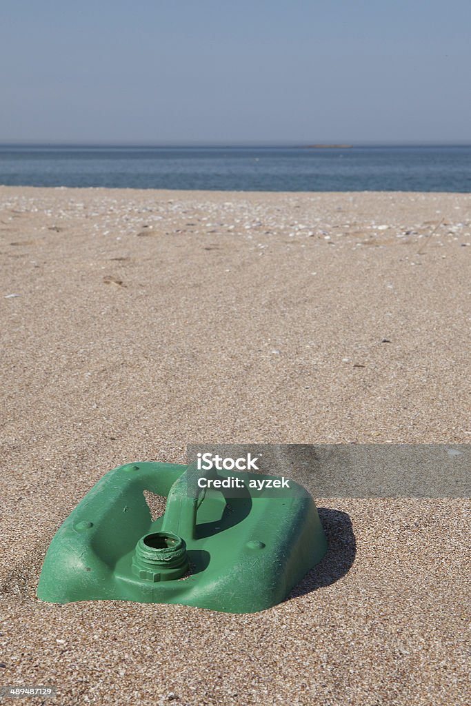 Pollution - Plastic Jerry Can on Beach Pollution - Plastic Jerry can on sond. Beach Stock Photo