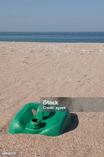 Pollution Plastic Jerry Can On Beach Stock Photo - Download Image Now - Beach, Gas Can, Bag
