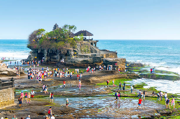 tanah lot is very popular destination for tourist at bali island indonesia