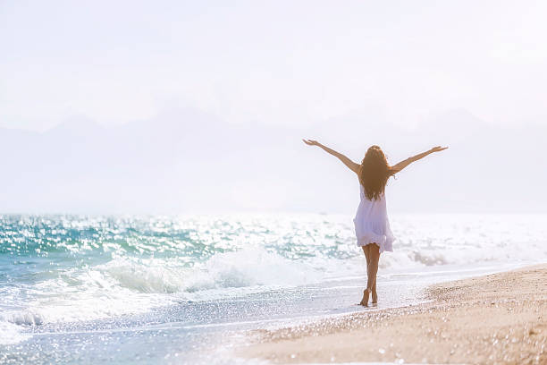 istock Happy girl on the beach 489488379