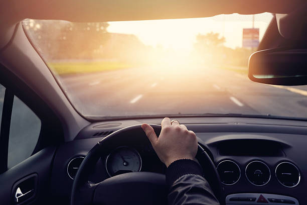 istock driver traveling on a road to the sun 489488954