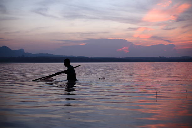 istock River and Silhouette Fisherman 489489672