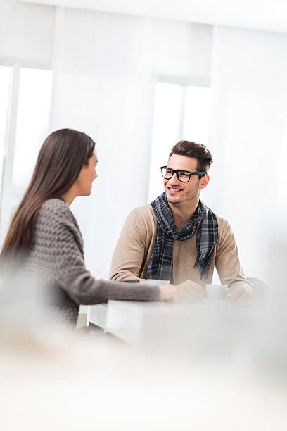 istock Smiling man talking to his girlfriend in a cafe. 489490778