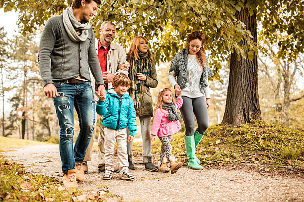 istock Smiling extended family taking a walk at the park. 489491144