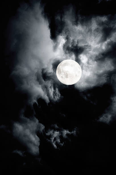 Dark Cloudy Sky With Full Moon Stock Photo - Download Image Now