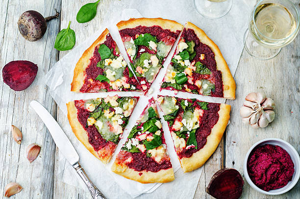 beet hummus spinach goat cheese pizza beet hummus spinach goat cheese pizza. the toning. selective focus crostata stock pictures, royalty-free photos & images