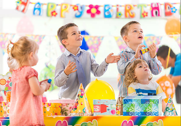 istock Playful children having fun on a birthday party. 489492136