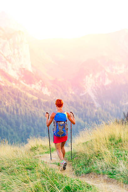 istock Woman hiker in mountain trekking 489493128