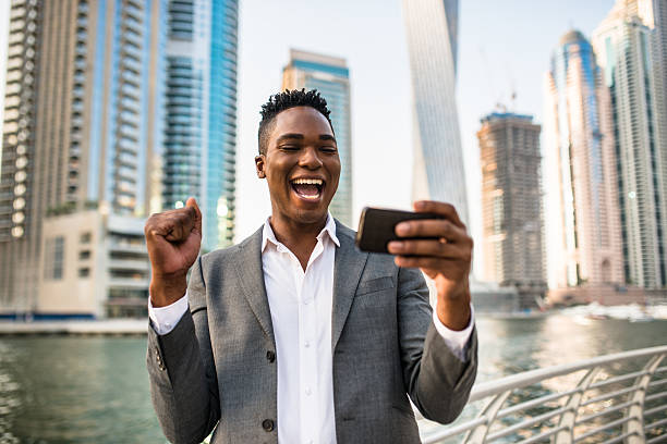 istock Successful business man against the skyscraper 489515456
