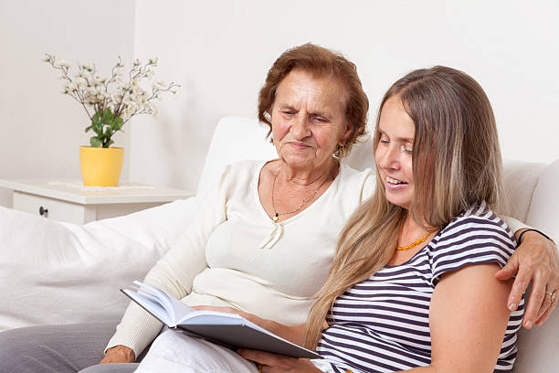 istock Carer spending time with an elderly woman 489518264