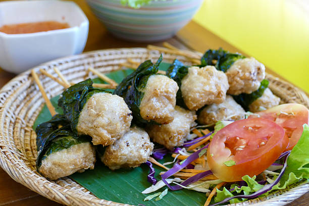 istock grilled pork wrapping with Wildbetal leafbush 489518904