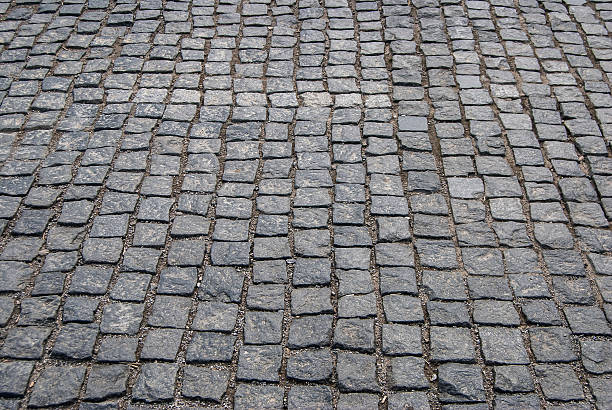 istock Abstract background of old cobblestone pavement close-up 489519992