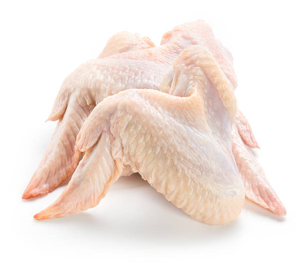 istock Raw chicken wings isolated on white background 489521554