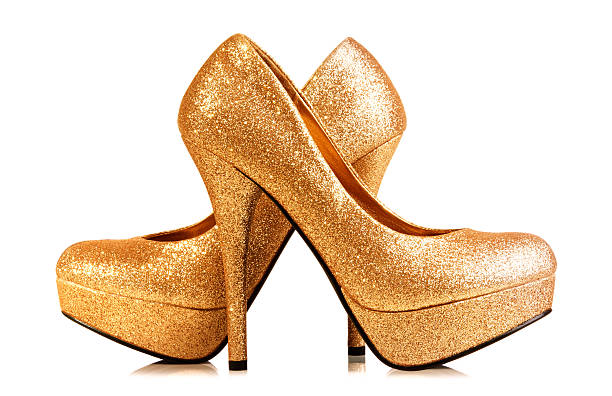 istock Pair of gold heels isolated on white. With Clipping path. 489522390