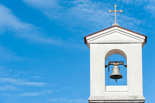 Small bell tower with a bell of a country church