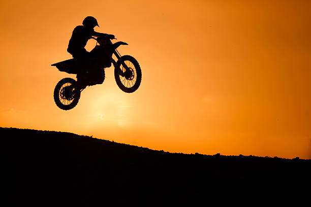 istock motorcycle silhouette are jumping 489525394