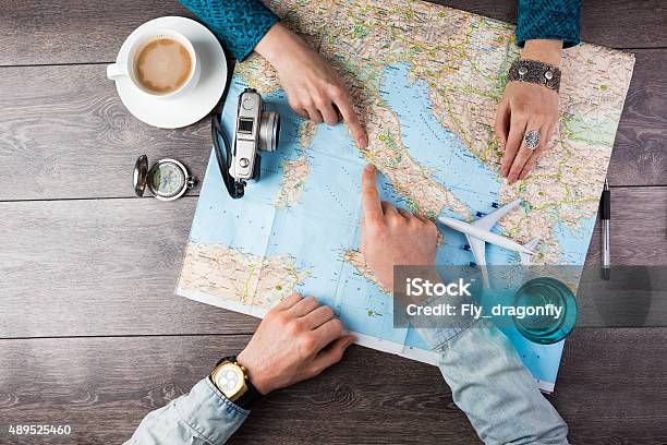 Couple Planning Honeymoon Stock Photo - Download Image Now - Travel, Map, Journey