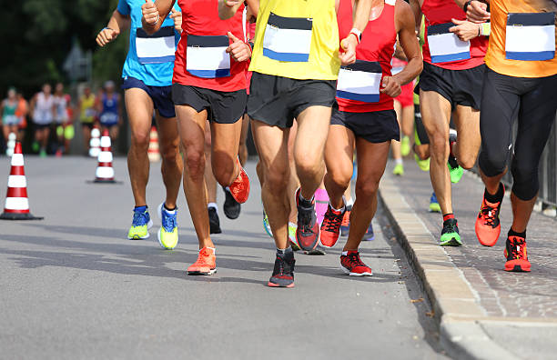 istock Runners during the Marathon on the road in town 489526886