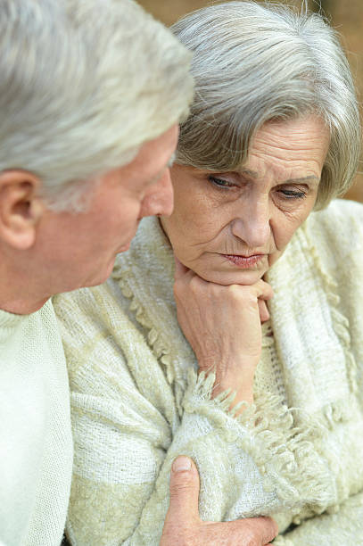 istock Elderly couple in autumn forest 489527816