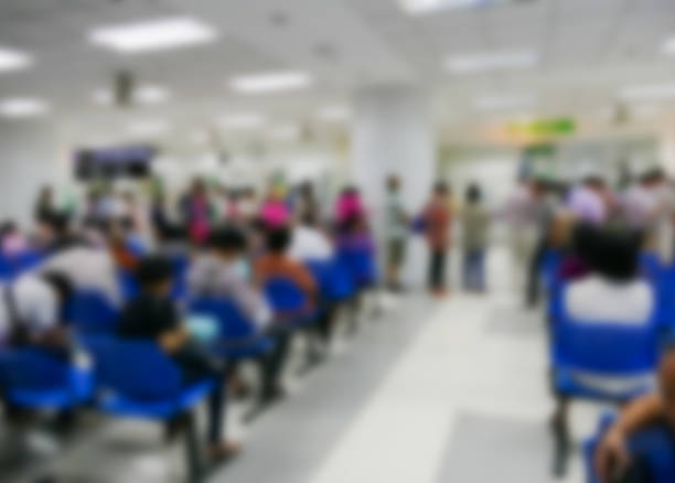 istock blurry defocused image of people waiting to see doctor 489528110