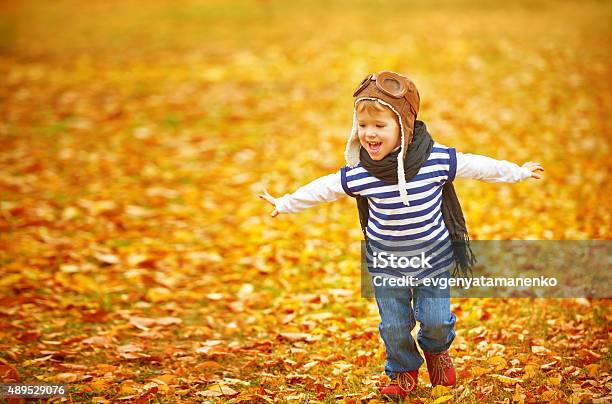 Happy Child Playing Pilot Aviator Outdoors In Autumn Stock Photo - Download Image Now