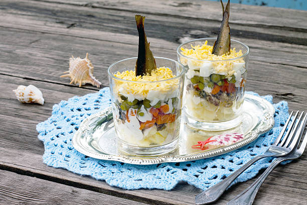 istock Salad with sprats, vegetables and green peas 489530128