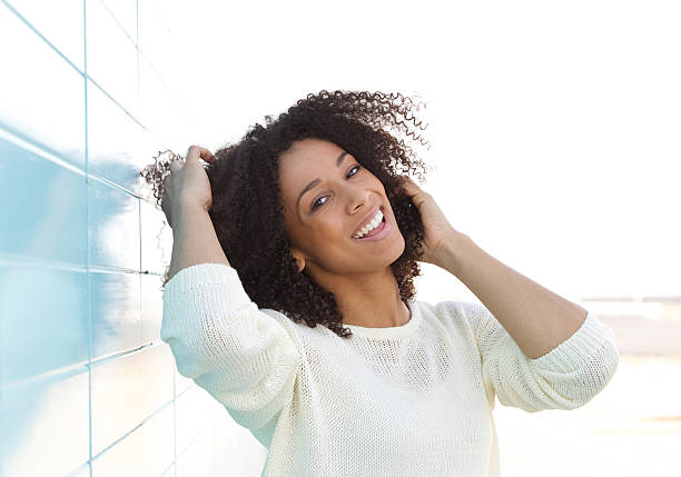 istock Attractive young woman smiling outdoors 489543849