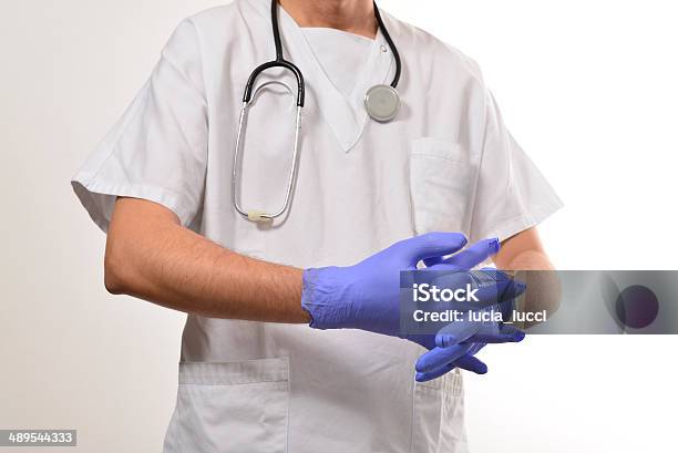 Doctor With Protective Gloves Stock Photo - Download Image Now - Adult Student, Advice, Barren