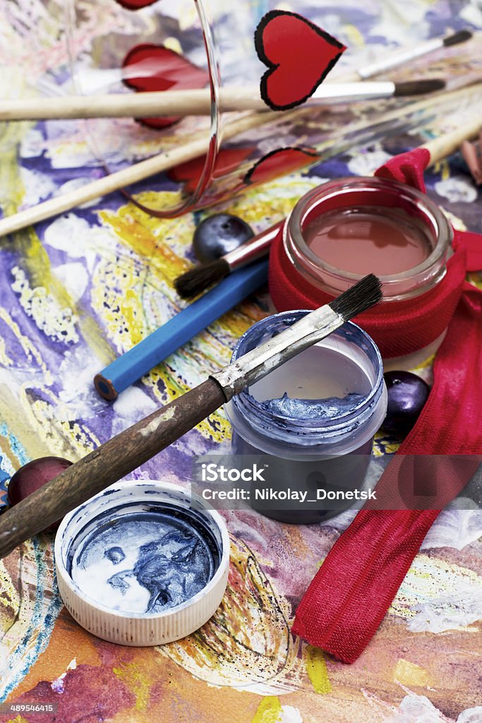 oil paint four colors and old brush scenery with a set of brushes and paints for painting Art Stock Photo