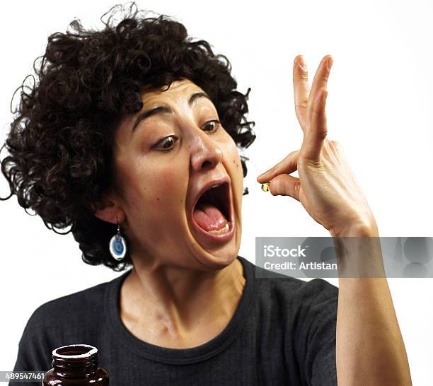 Woman Swallows A Pill Stock Photo - Download Image Now - Capsule - Medicine, Humor, Pill