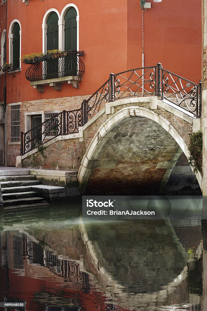 Venice bridge over canal Romantic and beautiful foot bridge over canal in Venice, Italy Arch Bridge Stock Photo