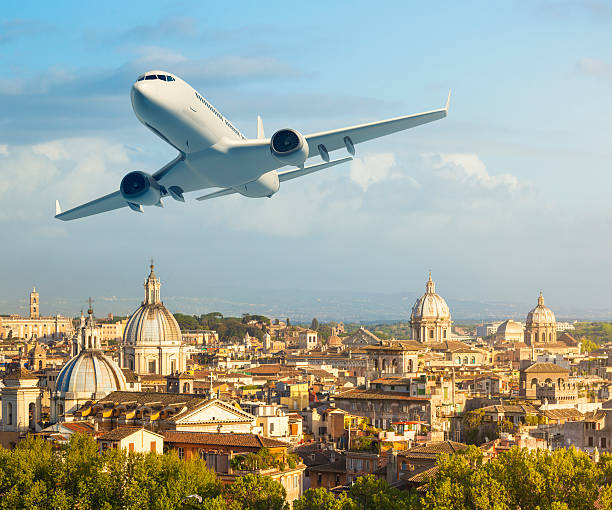 Airplane over Rome stock photo