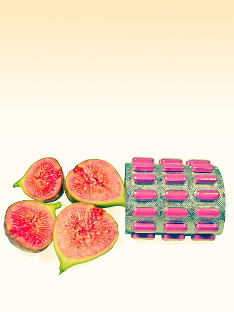 istock Chopped Fig fruit, with Pack of pills, tablets medicine, Concept 489554386