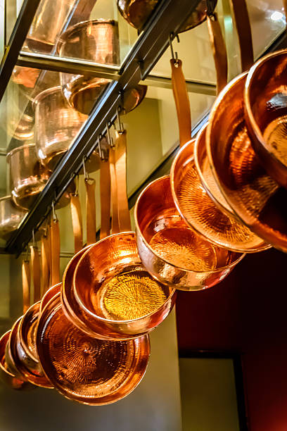 istock hanging copper pots, pans, saucepans 489555860