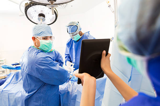 Performing Surgery Using Computer 4,400+ Operating Theatre Computer Stock Photos, Pictures & Royalty-Free ...