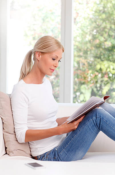 istock woman sitting at home 489558954