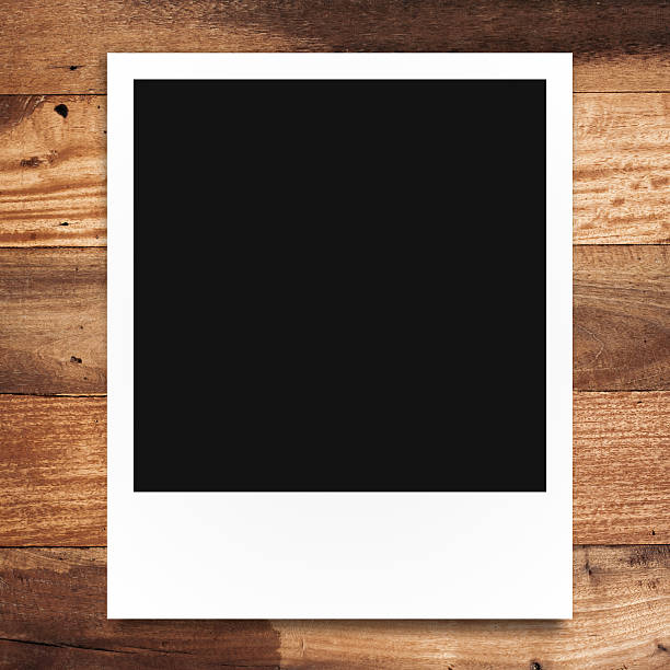 istock blank photo frame on brown wood background 489560740