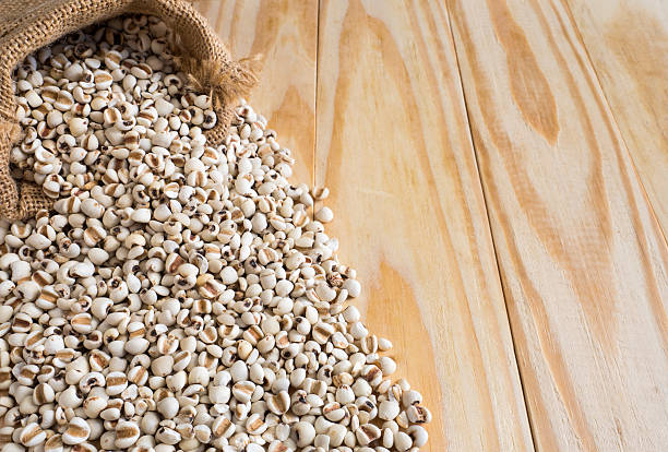 istock Millet in sack on wood Background 489562454