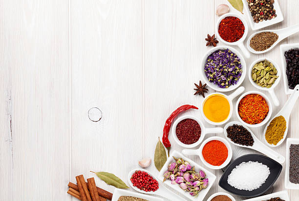 istock Various spices on white wooden background 489562784