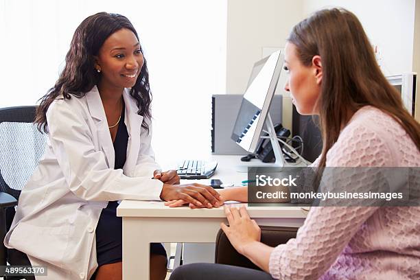 Female Doctor Treating Patient Suffering With Depression Stock Photo - Download Image Now