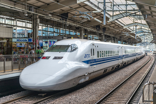 Kyoto, Japan - August 12, 2015: JR700 shinkansen bullet train departing Kyoto station