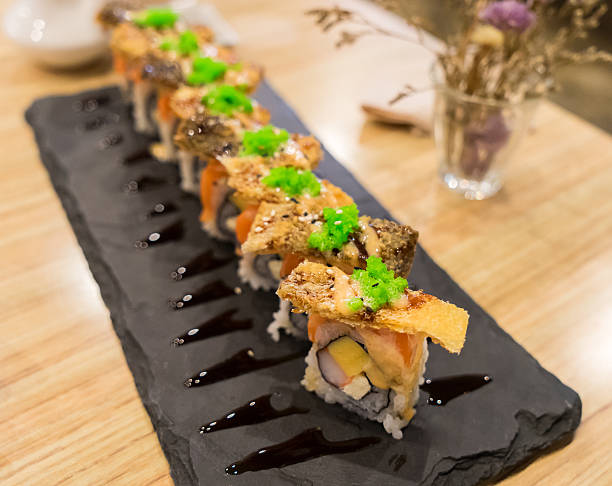 istock Crispy Skin Salmon Japanese Rolls Top view 489564244