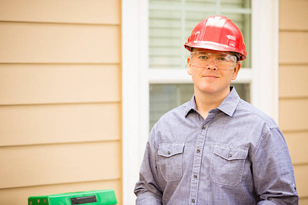istock Inspector or blue collar workers examines building wall. Outdoors. 489564416
